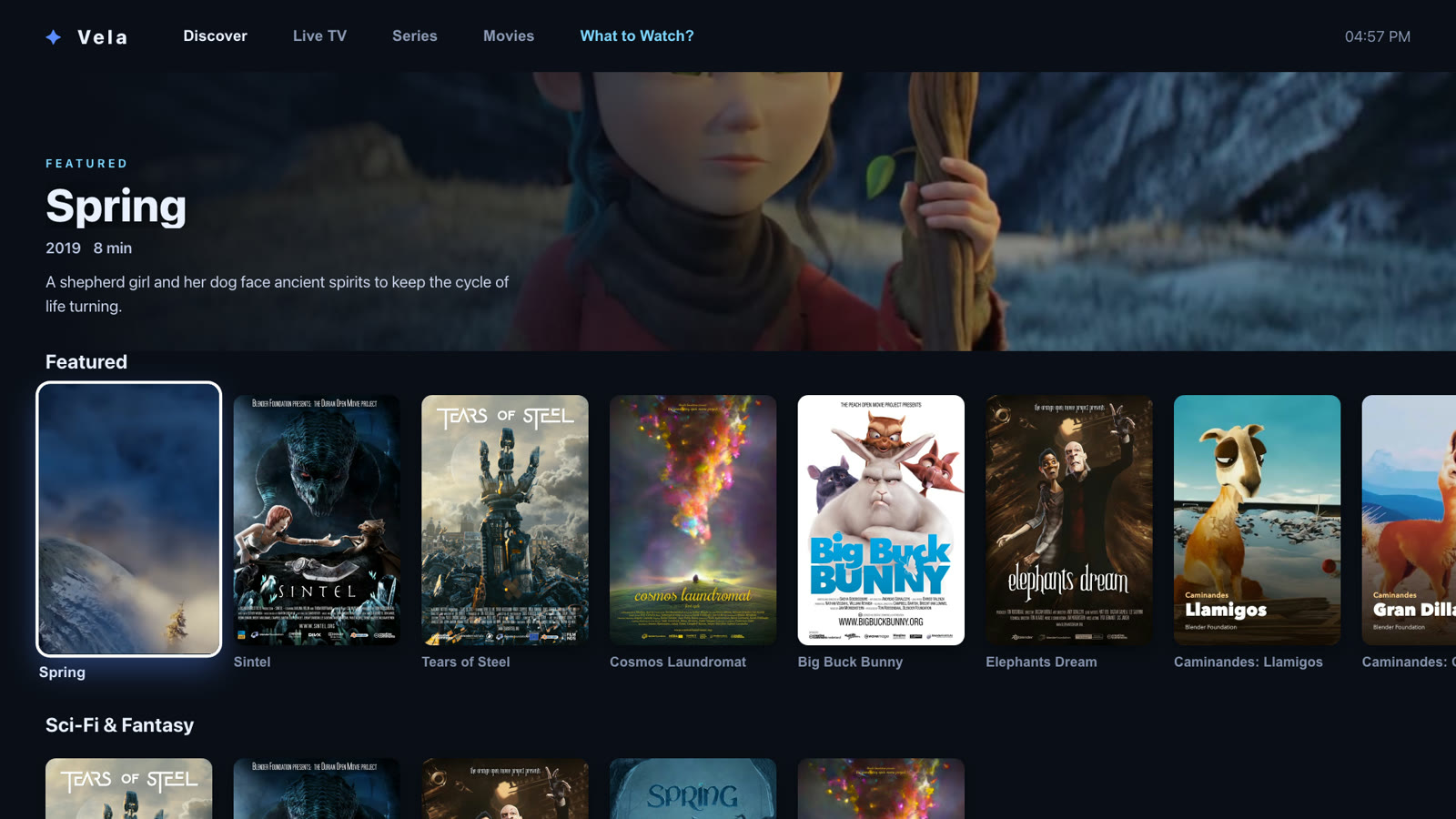 The Vela home screen on a TV: a featured title across the top and rows of posters below, with the first poster focused by the remote.